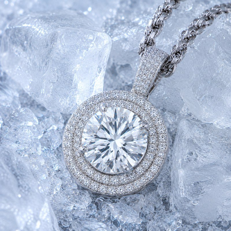 Silver round diamond halo pendant displayed on ice